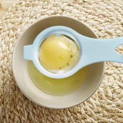 Séparateur blanc d'oeuf plastique bleu ou rose