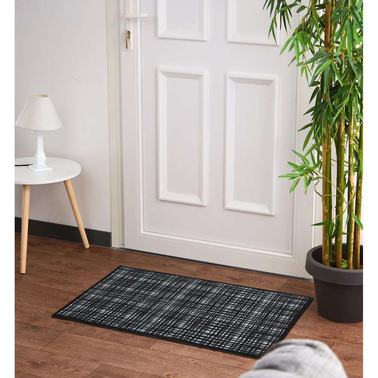 Tapis anti poussière à carreaux noir et blanc
