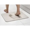 Tapis de salle de bain blanc magique